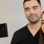 Doctor and female patient are having their photo taken in the surgery